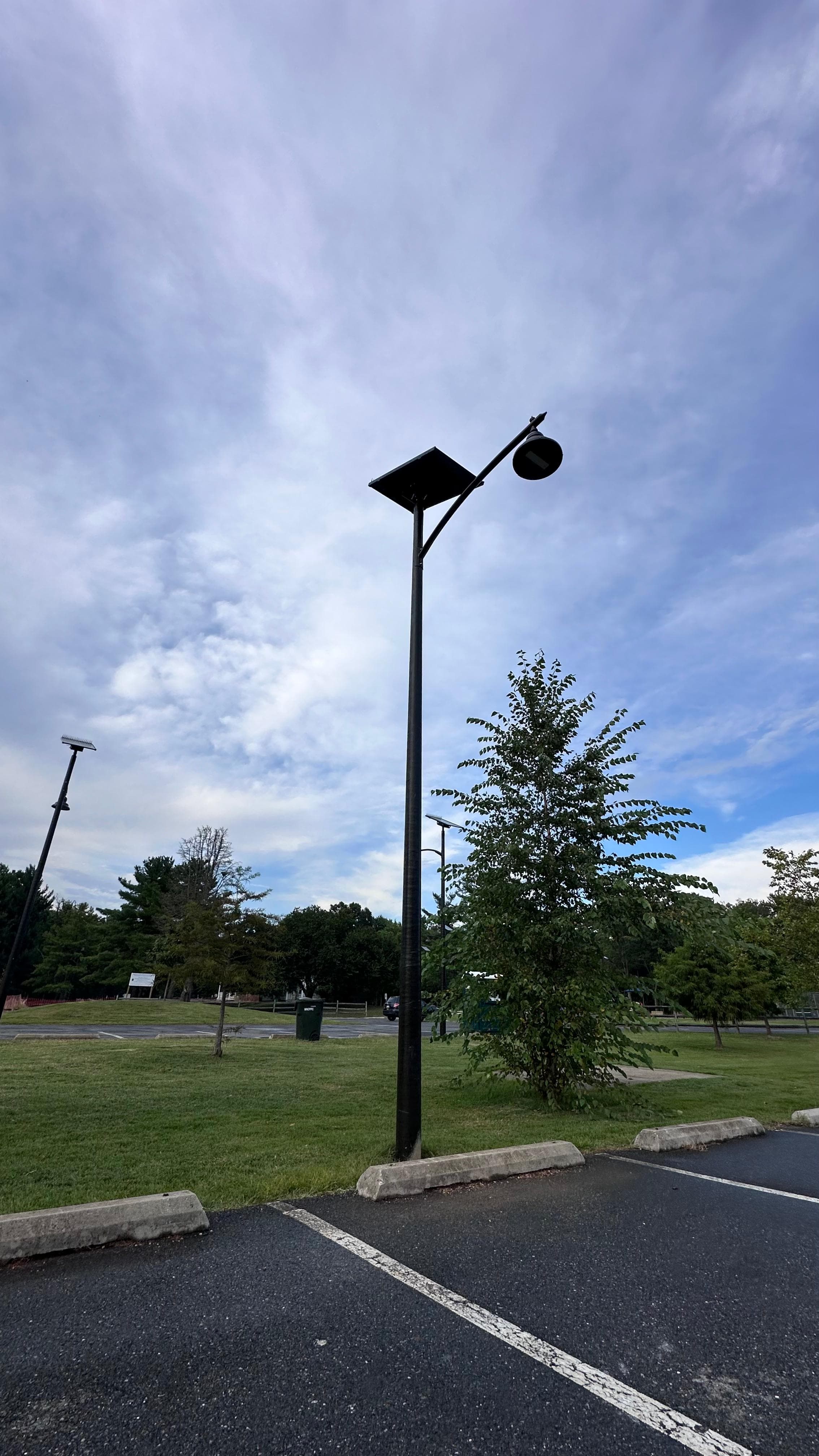 Single All Seasons pole standing in a Riverview Park parking lot during the day