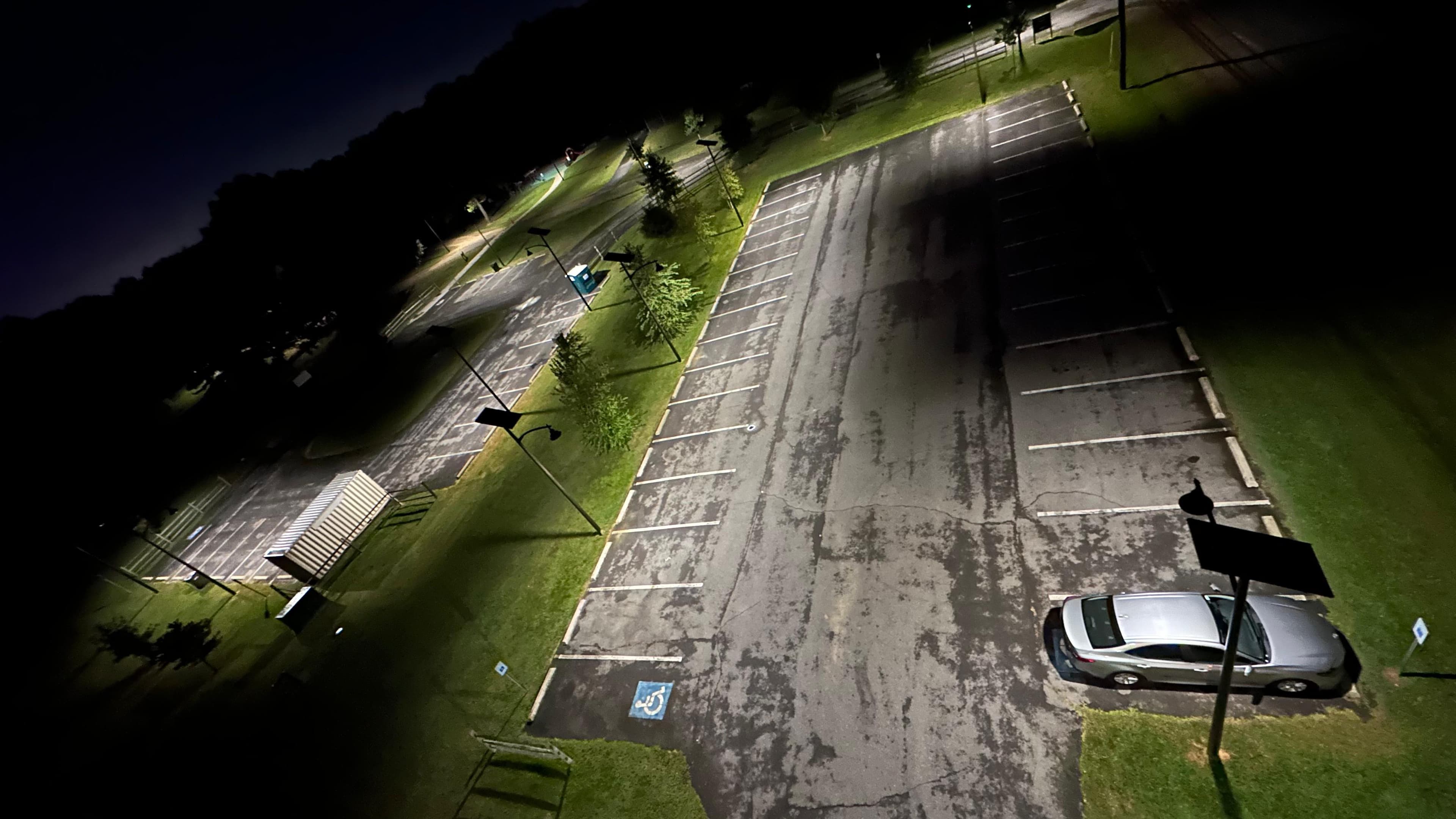 Aerial nighttime view of the All Seasons poles lighting the Riverview Park parking lot